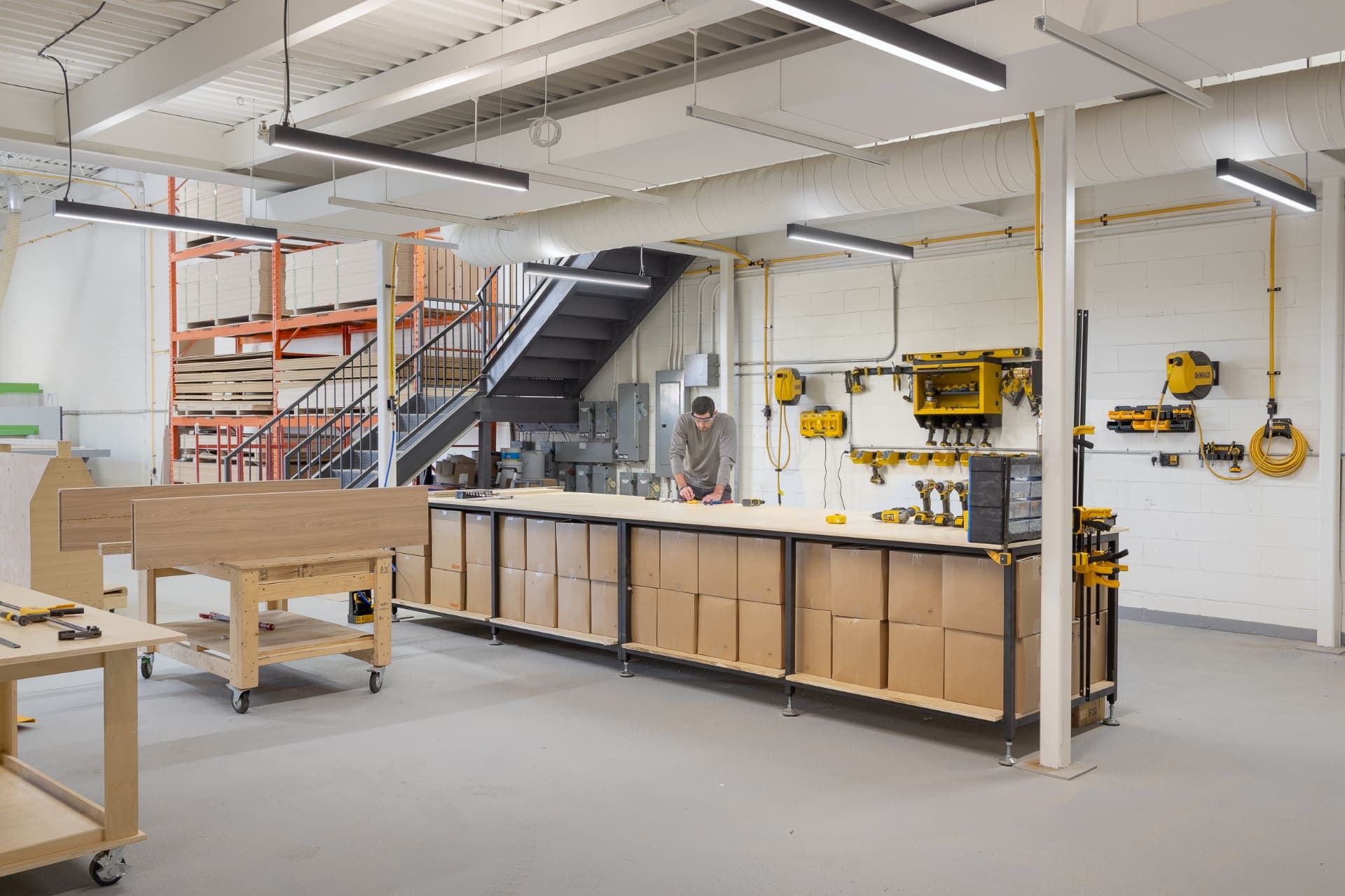 A Cabintie assembly bench, with cabinets boxed and labeled for delivery